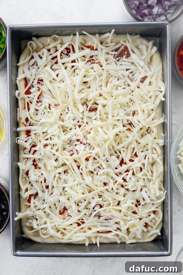 Fluffy Focaccia Pizza Dough Recipe 17 Focaccia pizza dough topped with sauce, cheese, and various pizza toppings.
