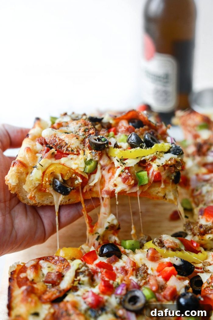 Fluffy Focaccia Pizza Dough Recipe 18 A delicious slice of focaccia pizza with melted cheese and a crispy crust.