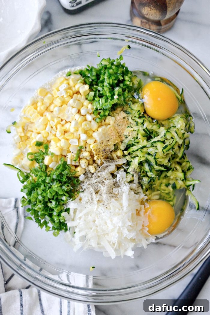 Crispy Zucchini Corn Fritters 8 All Zucchini Corn Fritter ingredients added to a mixing bowl