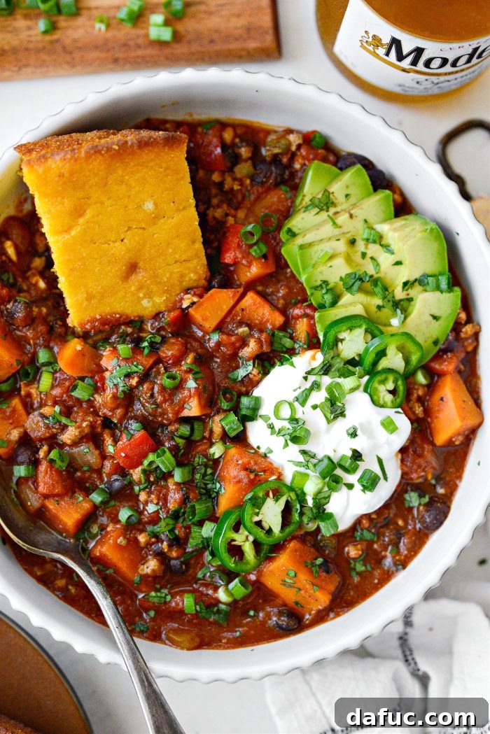 Sweet Potato Turkey Chili served in a bowl with toppings