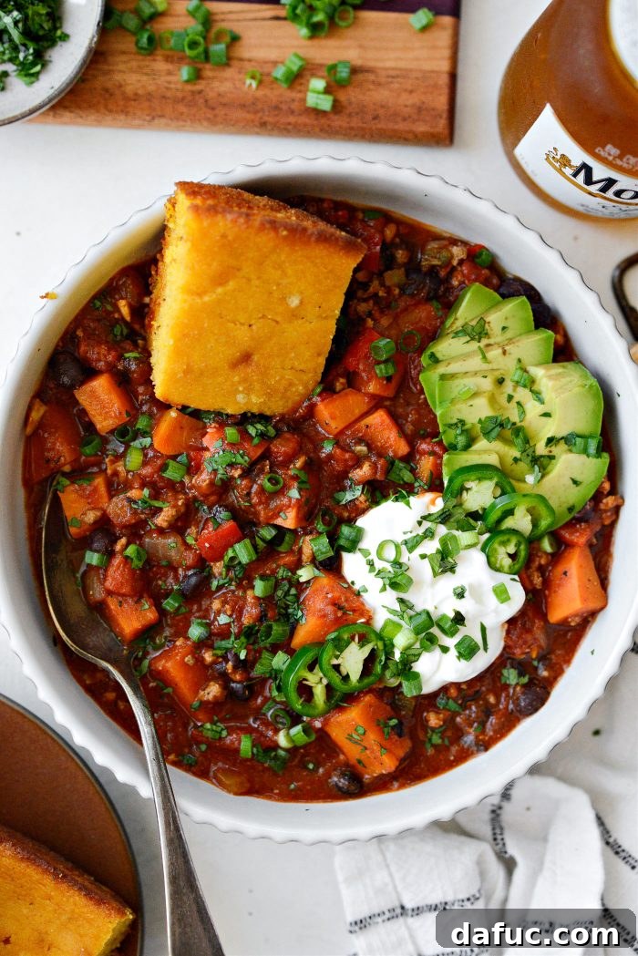 Sweet Potato Turkey Chili served in bowls with toppings
