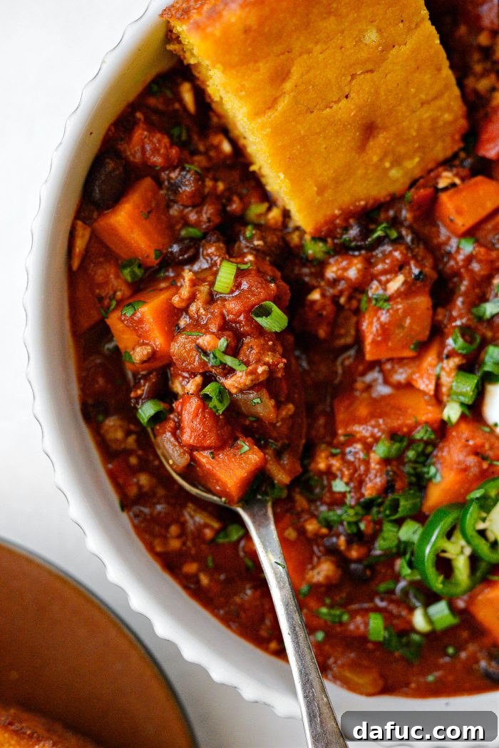 Sweet Potato Turkey Chili in a bowl with a spoon