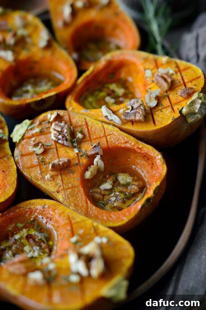 Close-up of a perfectly roasted Maple Rosemary Honeynut Squash half.