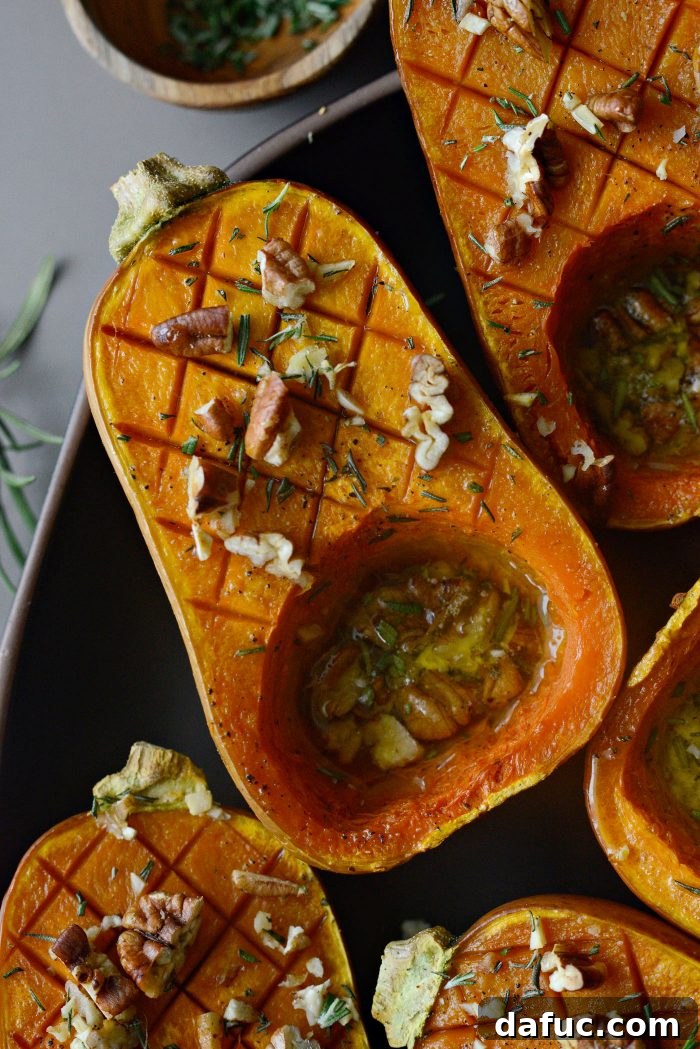 Another appealing shot of Roasted Maple Rosemary Honeynut Squash on a plate.