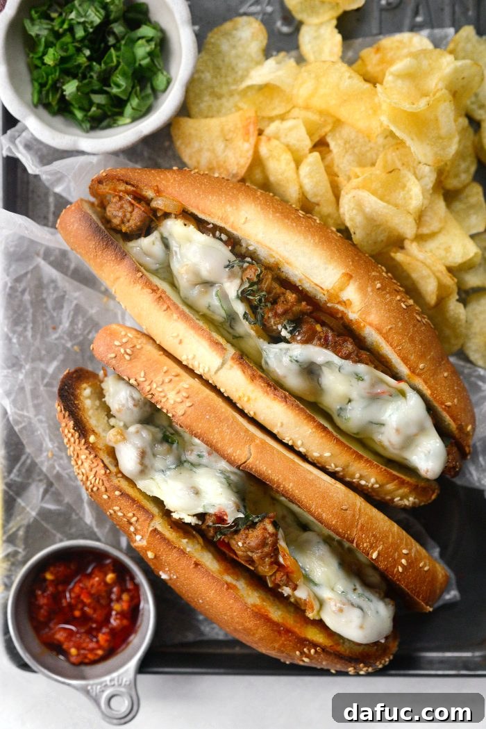 Spicy Italian Sausage Sub - A close-up shot of a beautifully prepared sub, overflowing with sausage, peppers, and melted cheese on a crusty roll.