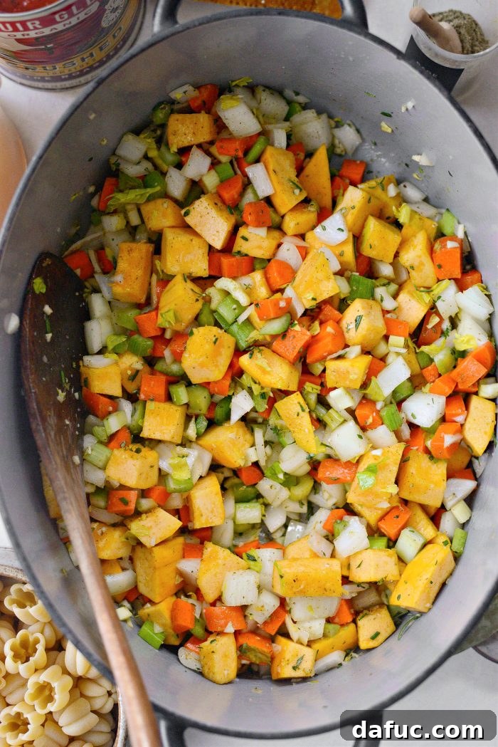 Golden Autumn Pumpkin Minestrone 10 Stirring vegetables to coat them in the fat