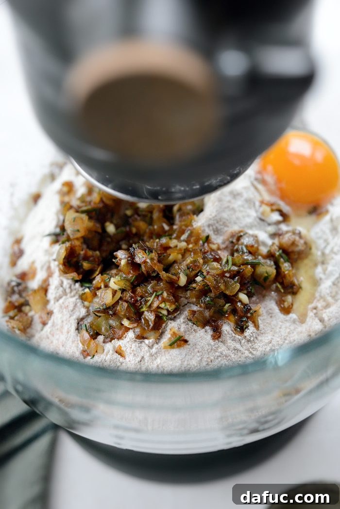 Fragrant Rosemary and Sweet Caramelized Onion Whole Wheat Rolls 12 add flours, salt, egg and caramelized onion mixture