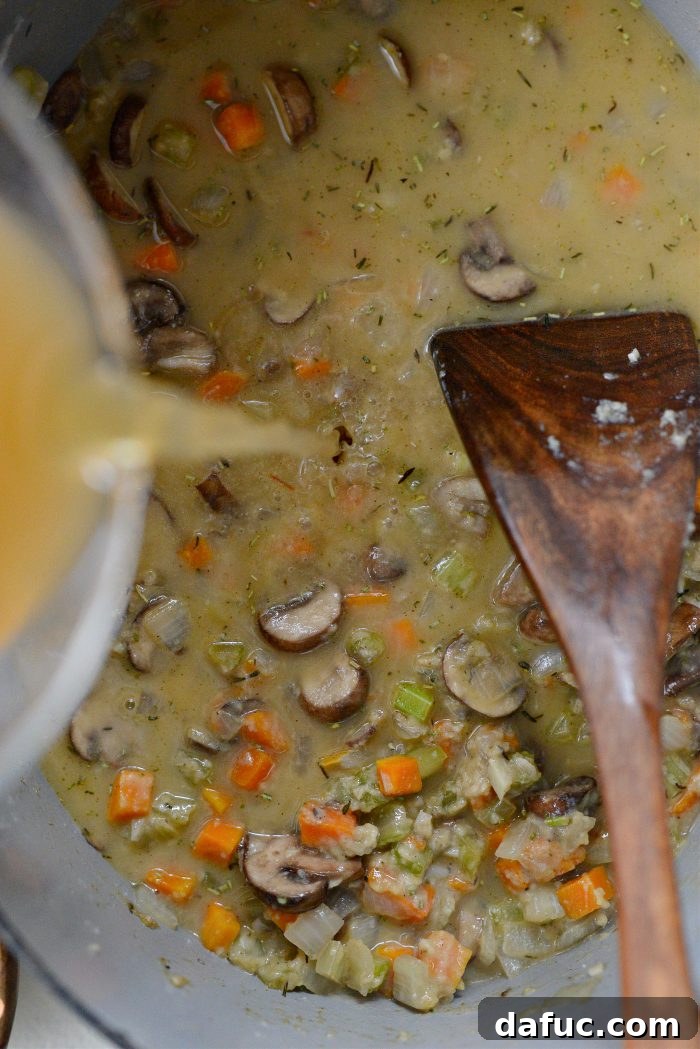pour in broth and water