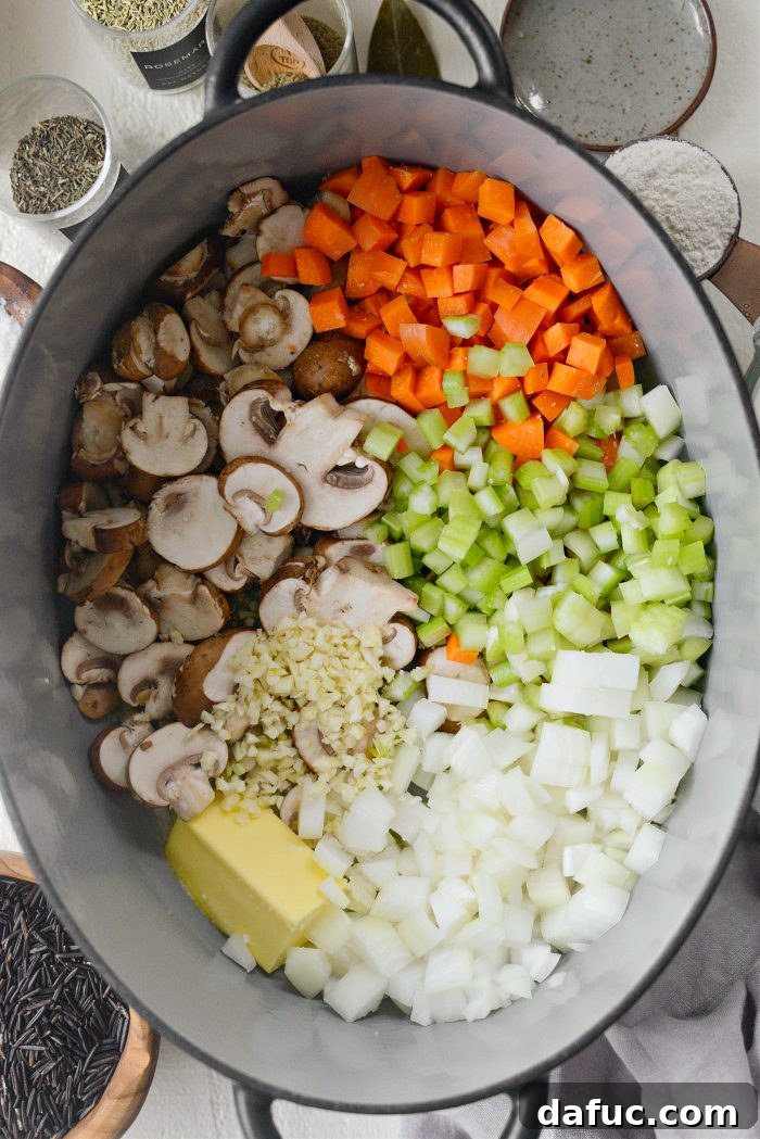 Dutch oven with butter and veggies, garlic and salt