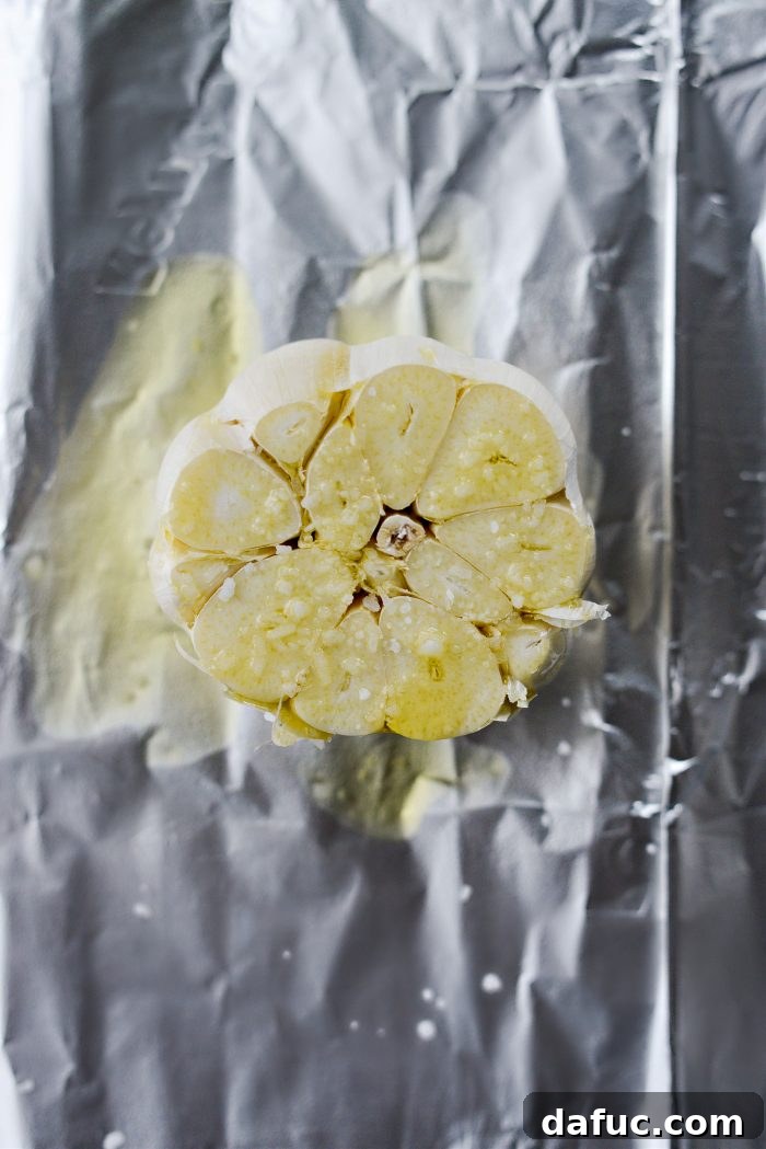Velvet Garlic Potatoes 5 Preparing garlic for roasting: head of garlic on foil with olive oil and salt