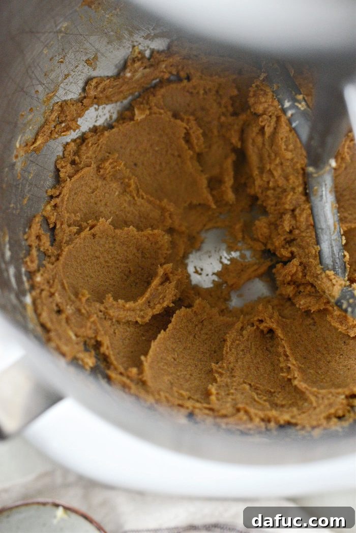 Mixing frosting ingredients until combined
