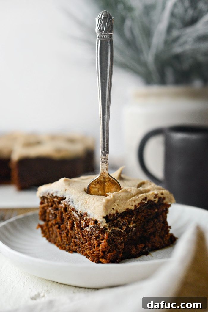 Close-up of a beautifully frosted Gingerbread Cake slice