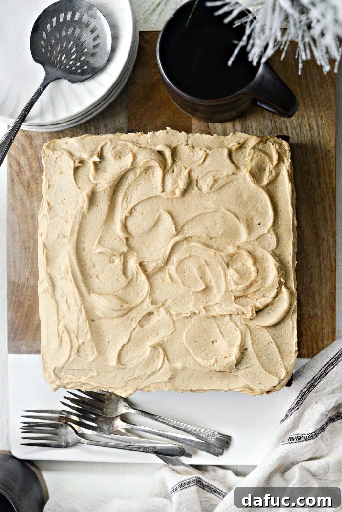 A beautifully decorated Gingerbread Cake with generous brown sugar frosting