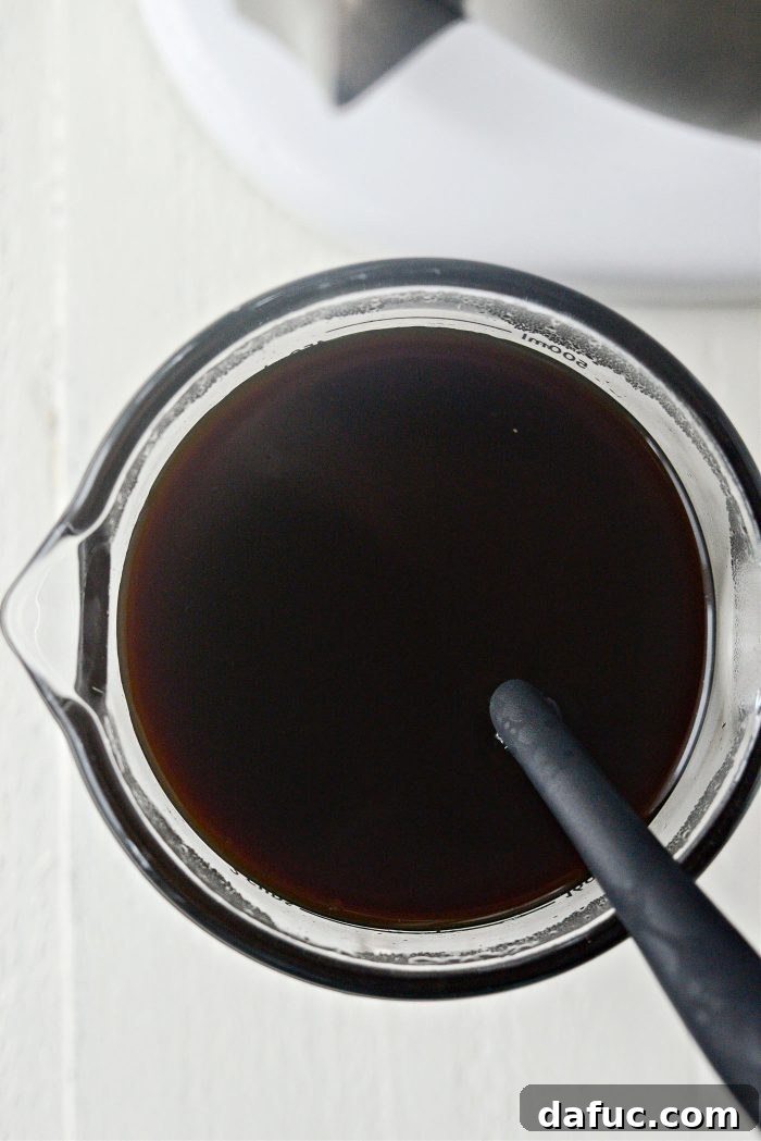 Stirring water into molasses