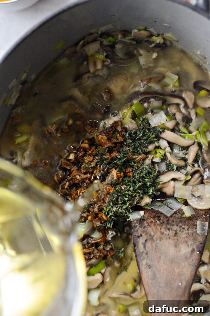 Gourmet Leek and Wild Mushroom Stuffing 12 Pouring dry white wine into the mushroom and leek mixture