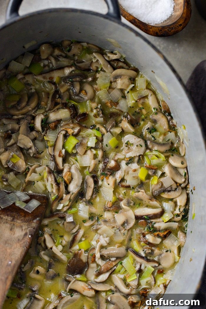 Gourmet Leek and Wild Mushroom Stuffing 13 Stirring the mushroom mixture as the wine evaporates