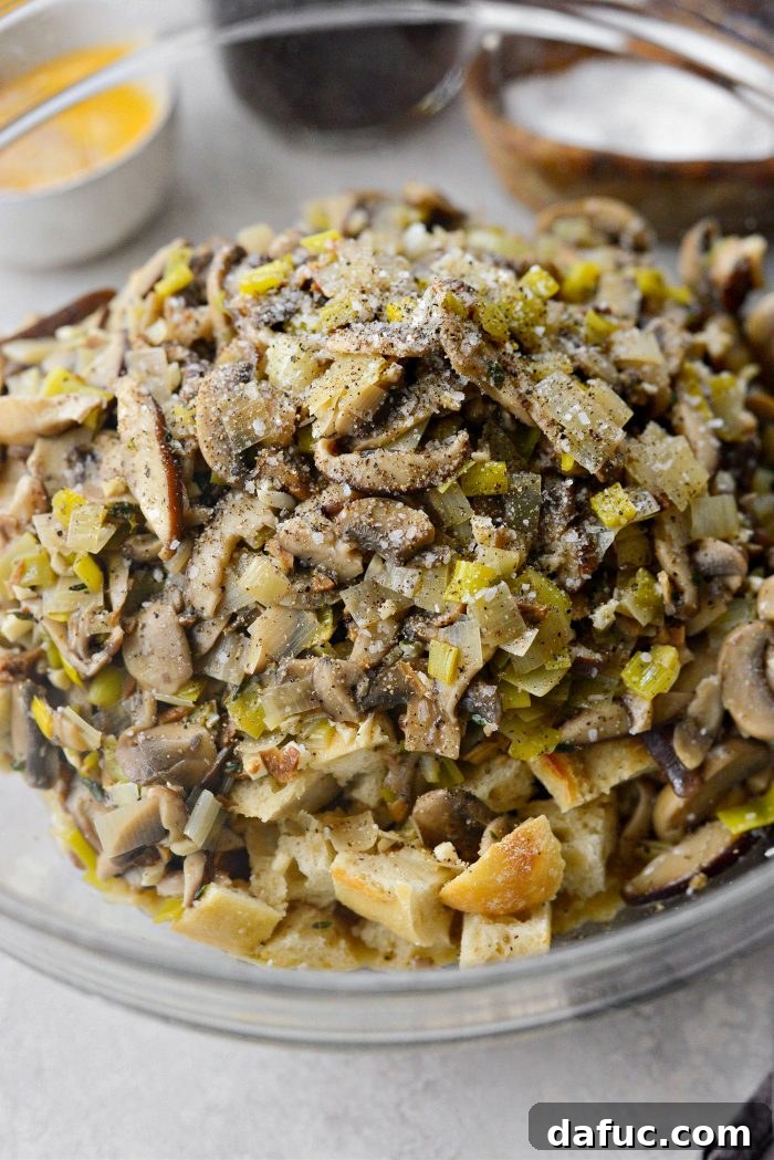 Gourmet Leek and Wild Mushroom Stuffing 14 Adding the cooked mushroom and leek mixture to the cubed bread