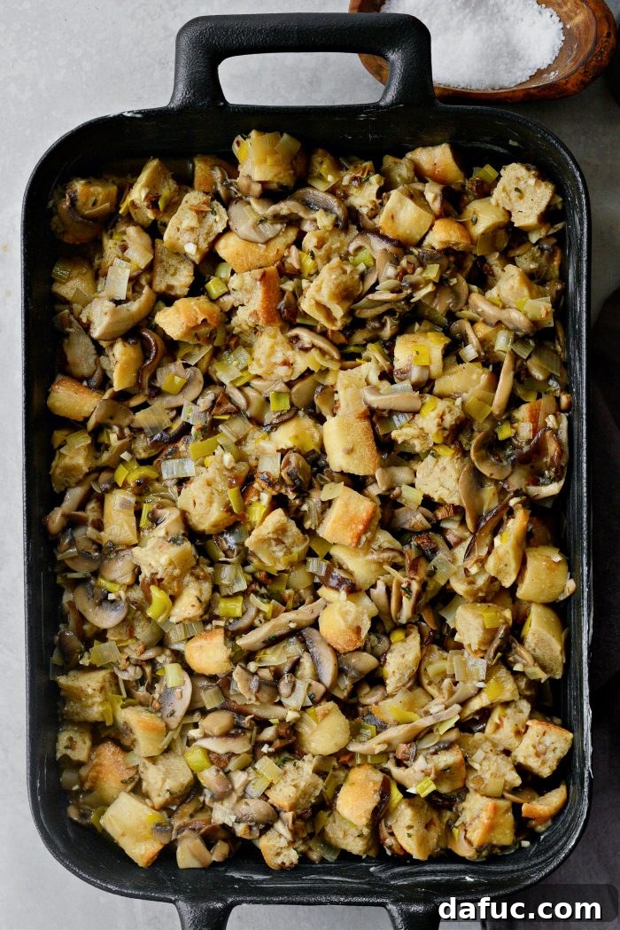 Gourmet Leek and Wild Mushroom Stuffing 19 Transferring the Leek and Wild Mushroom Stuffing to the prepared baking pan