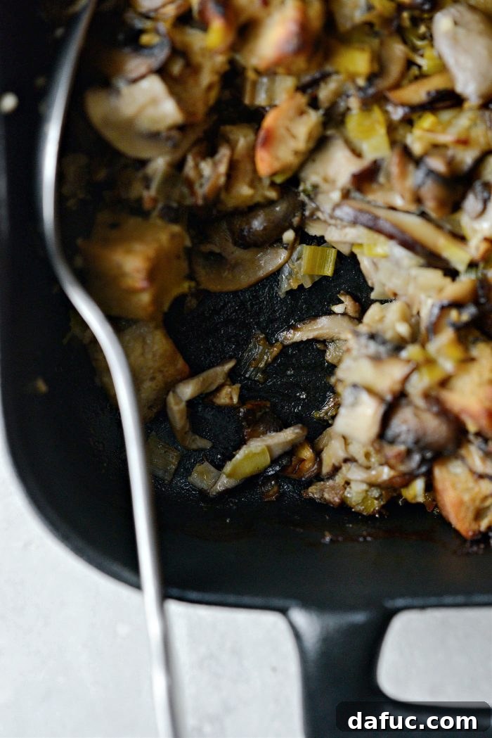 Gourmet Leek and Wild Mushroom Stuffing 24 Leek and Wild Mushroom Stuffing in a serving bowl with a spoon