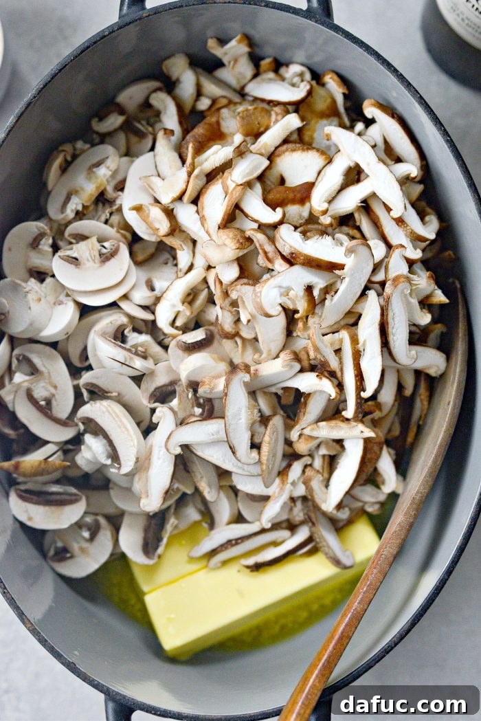 Gourmet Leek and Wild Mushroom Stuffing 9 Sliced shiitake and button mushrooms sizzling in butter in a Dutch oven