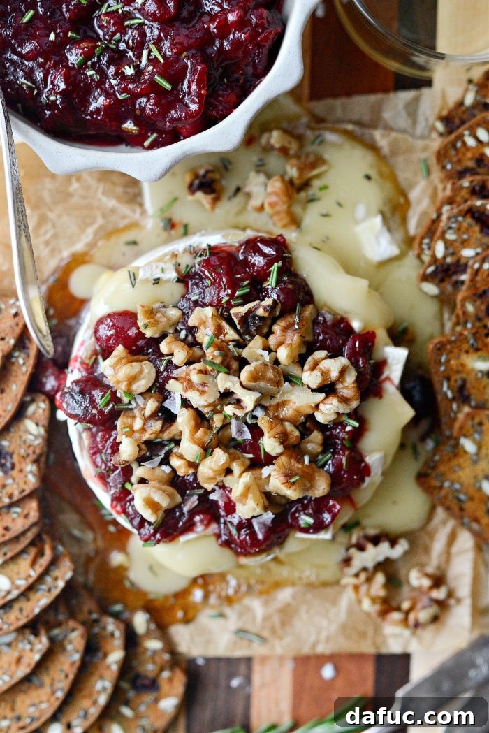 Golden Maple-Drizzled Brie with Ruby Cranberry Swirl 2 Melted Maple Baked Brie with Cranberry Jam, walnuts, and rosemary