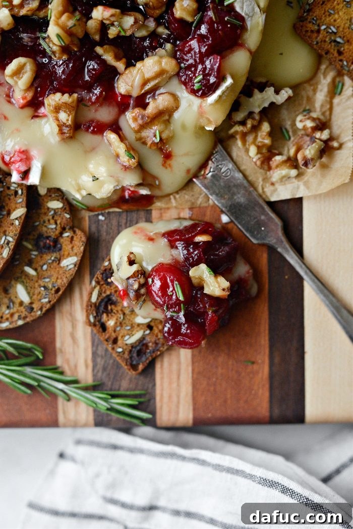 Golden Maple-Drizzled Brie with Ruby Cranberry Swirl 15 Maple Baked Brie with Cranberry Jam and cranberry pumpkin seed cracker crisps