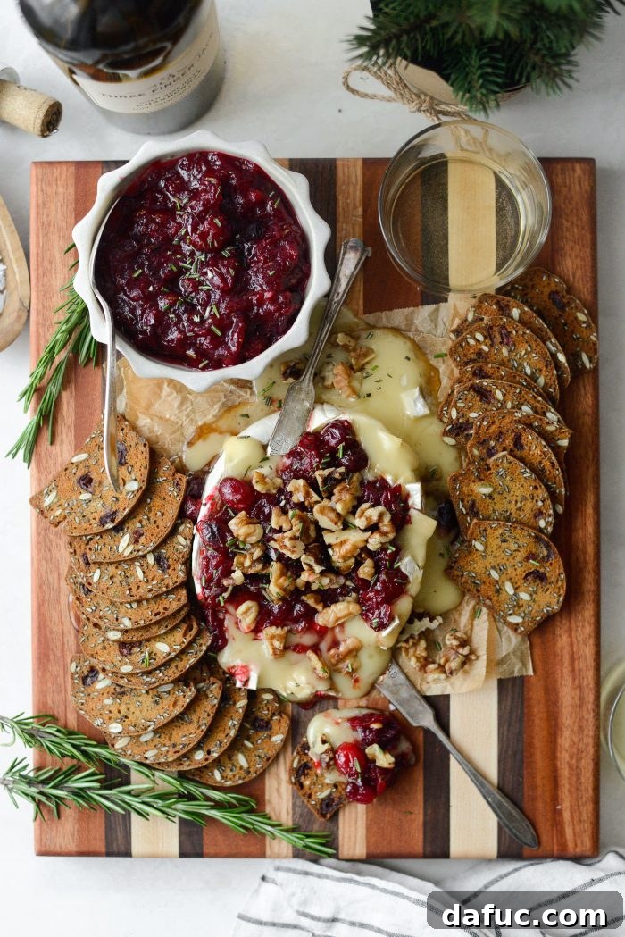 Golden Maple-Drizzled Brie with Ruby Cranberry Swirl 17 Beautifully garnished Maple Baked Brie with Cranberry Jam