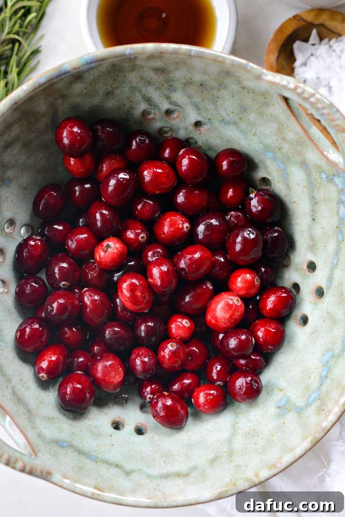 Golden Maple-Drizzled Brie with Ruby Cranberry Swirl 5 Fresh cranberries being rinsed in a colander