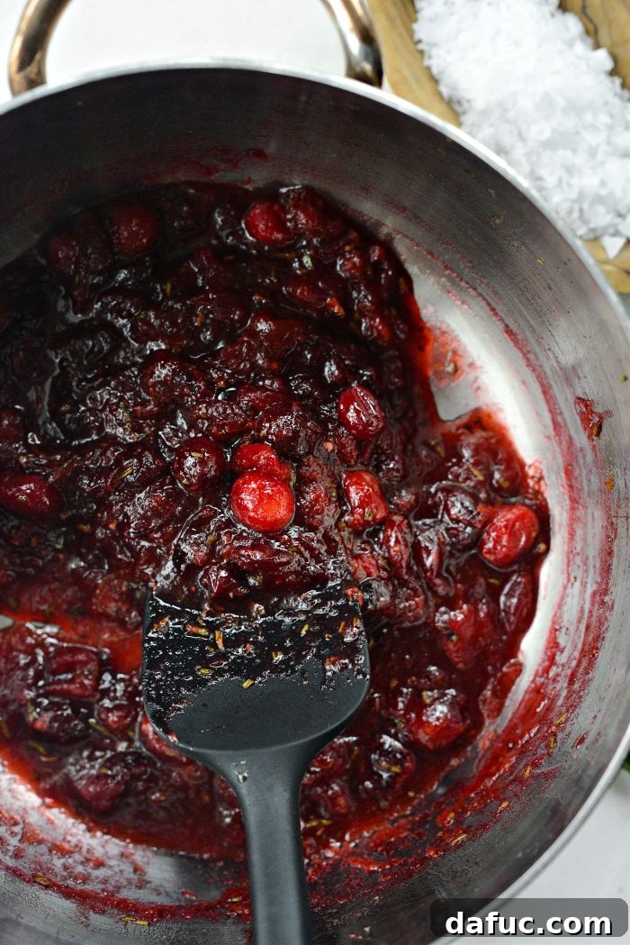 Golden Maple-Drizzled Brie with Ruby Cranberry Swirl 8 Homemade cranberry jam cooling in a saucepan