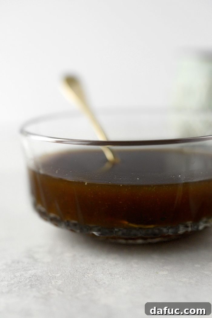 Close-up of a bowl of rich homemade Au Jus Gravy