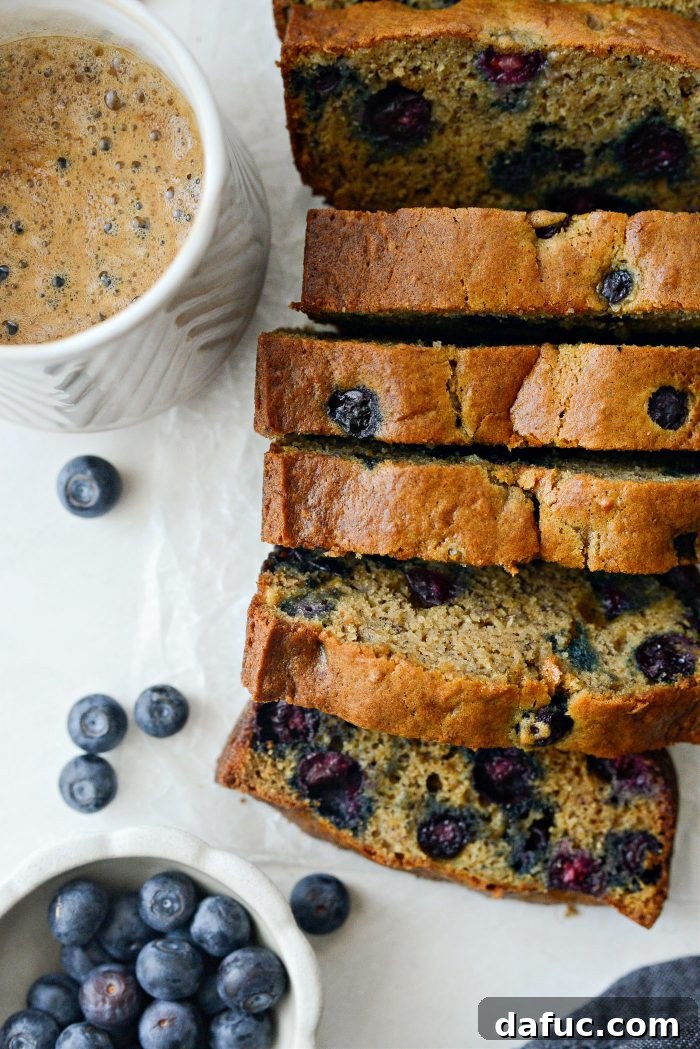 Freshly baked Blueberry Banana Bread loaf, sliced and ready to serve