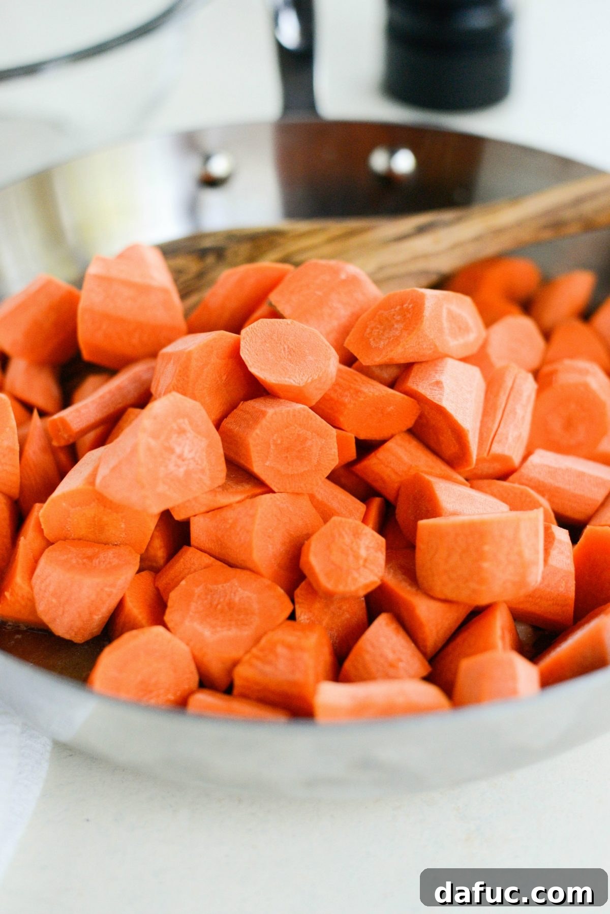 Caramelized Brown Sugar Carrots 5 Adding water, butter, brown sugar, and salt to a skillet, the initial steps for the glaze