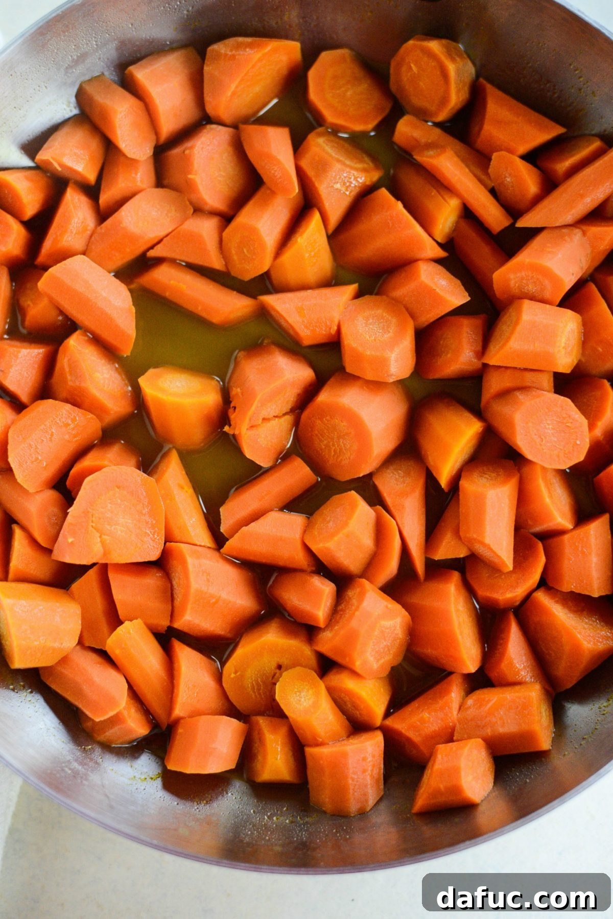 Caramelized Brown Sugar Carrots 8 The glaze thickening and bubbling around the carrots in the skillet as the water evaporates