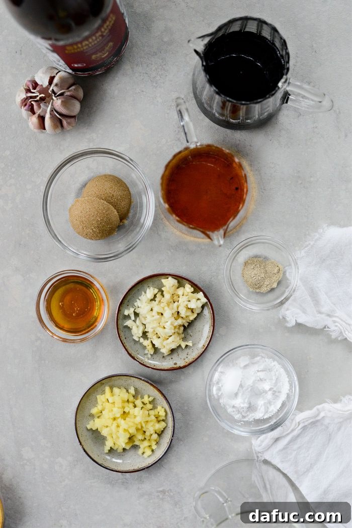 DIY Teriyaki Perfection 3 Ingredients laid out for homemade teriyaki sauce including soy sauce, honey, ginger, garlic, brown sugar, mirin, and cornstarch