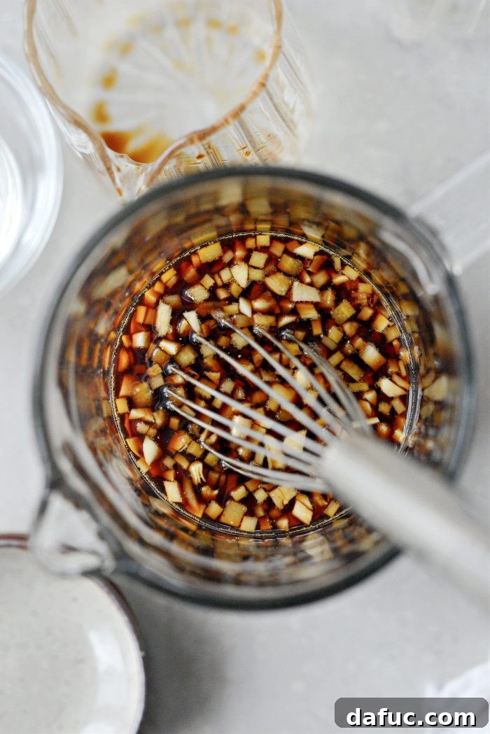 DIY Teriyaki Perfection 6 Whisking teriyaki sauce ingredients in a glass bowl to combine