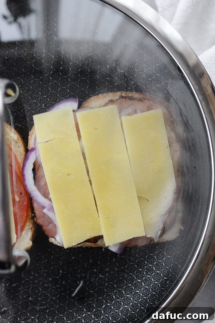 Irish Toast Delight 13 Covering the skillet with a lid to steam and melt the cheese