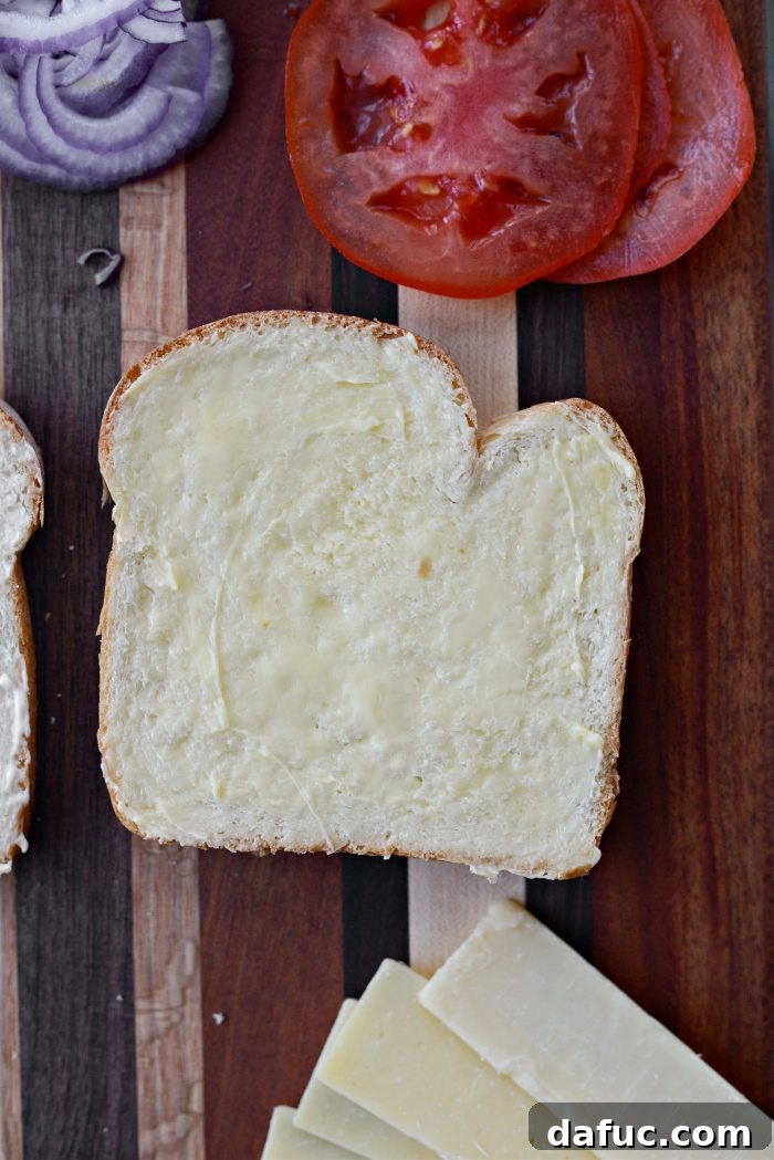 Irish Toast Delight 6 Spreading butter on one slice of bread for the Toasted Special