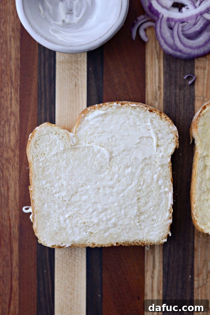 Irish Toast Delight 7 Spreading mayonnaise on the second slice of bread