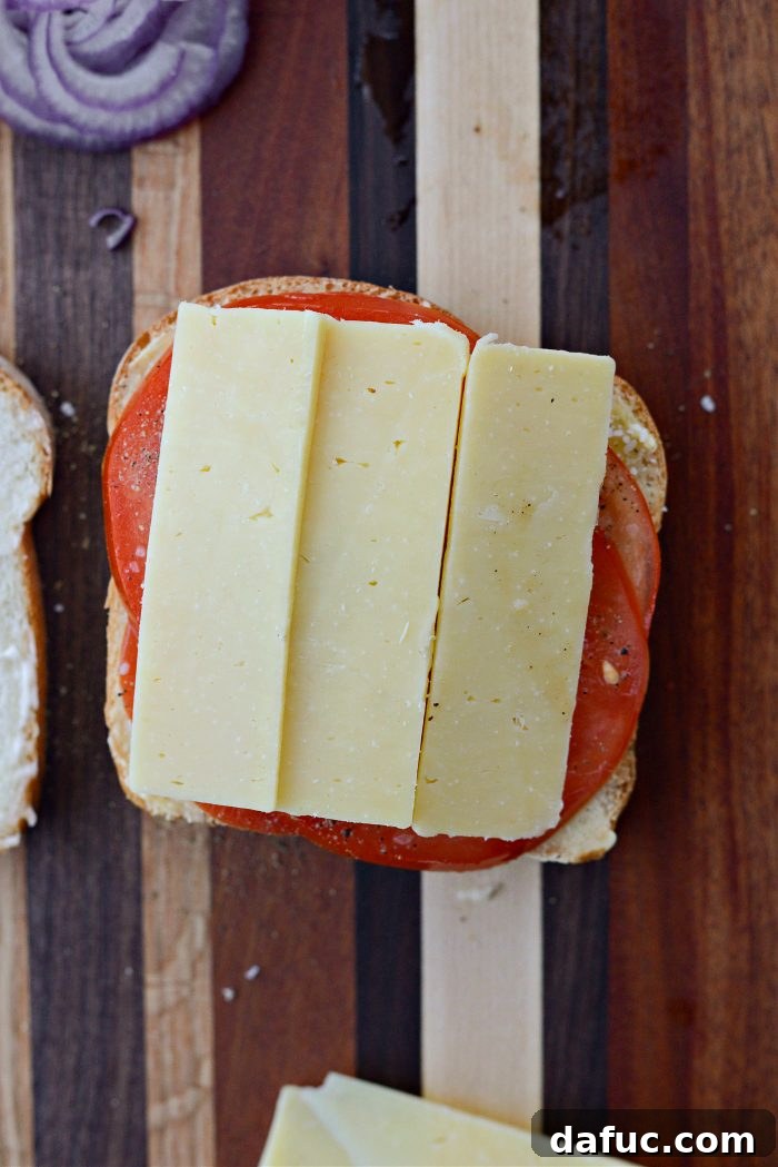 Irish Toast Delight 9 Layering Irish cheddar cheese over the tomatoes