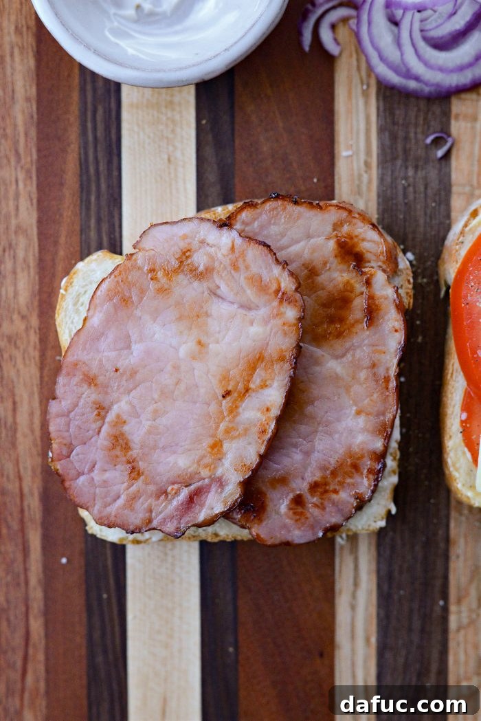 Irish Toast Delight 10 Adding fried ham to the mayonnaise-covered bread slice