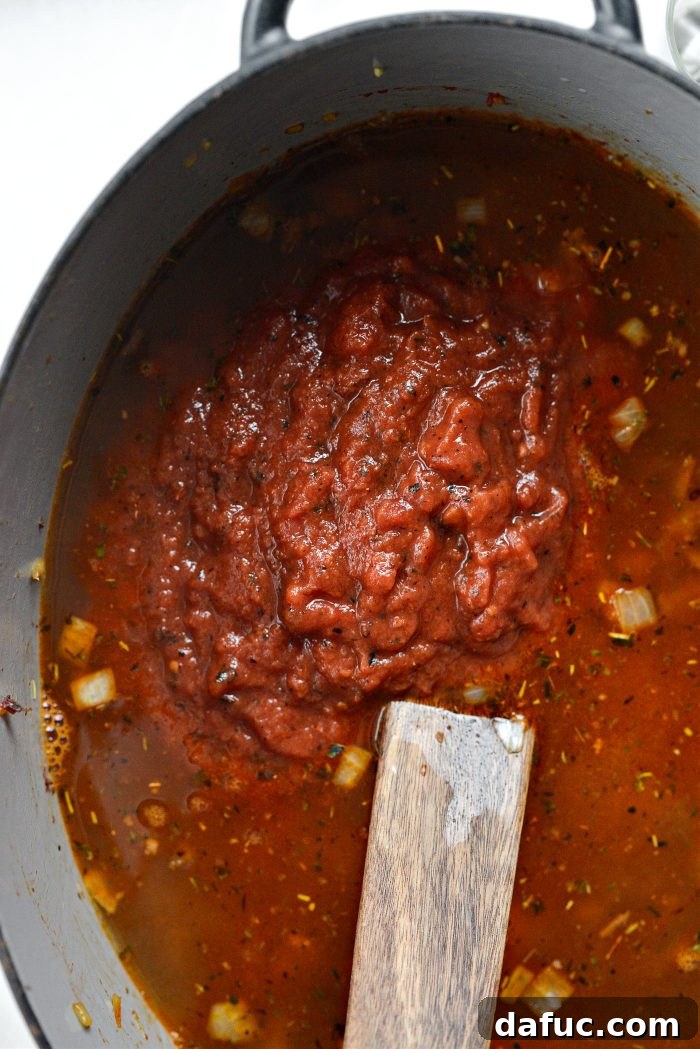 add broth and crushed fire roasted tomatoes