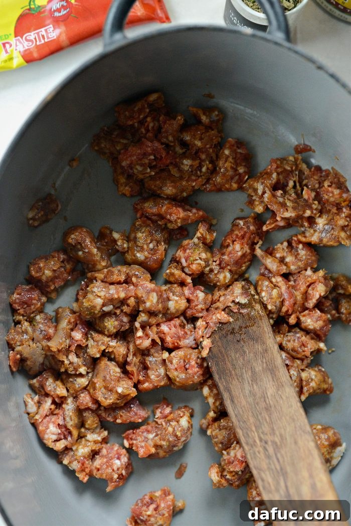 add olive oil and Italian sausage to dutch oven
