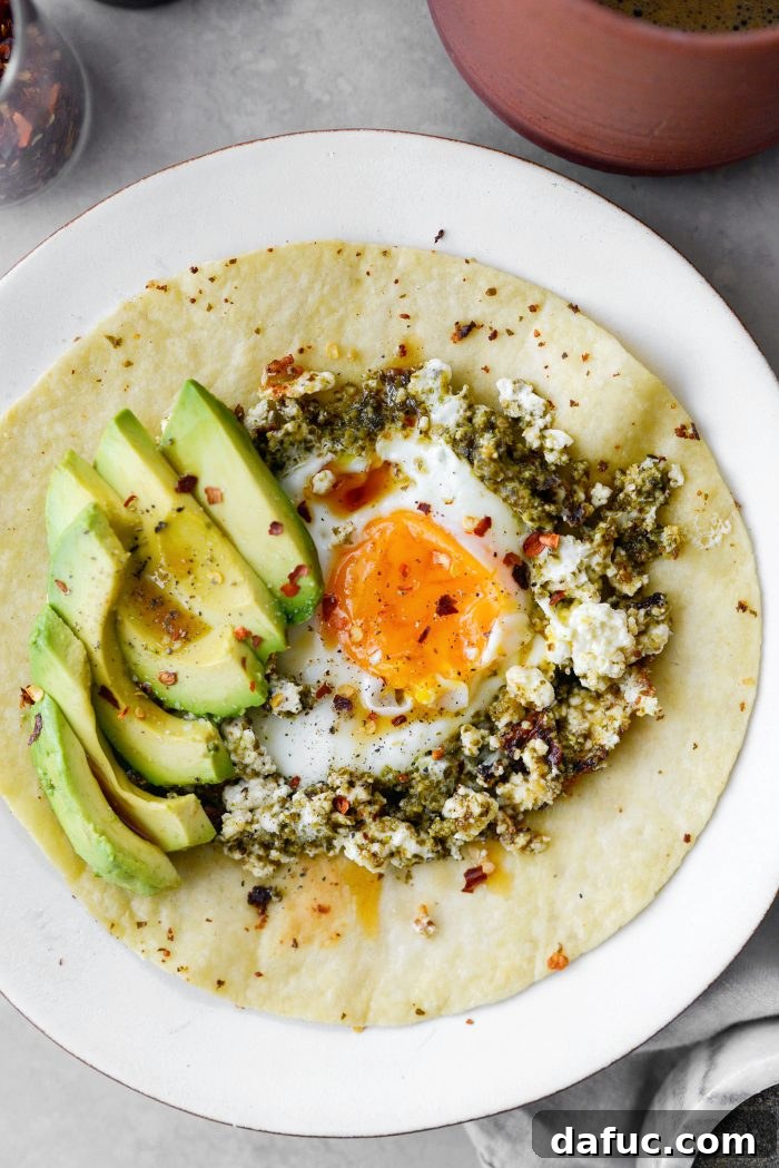 Three Delicious Feta Fried Egg Ideas 10 Basil Pesto Feta Fried Egg on a Toasted Tortilla with Avocado and Red Pepper Flakes