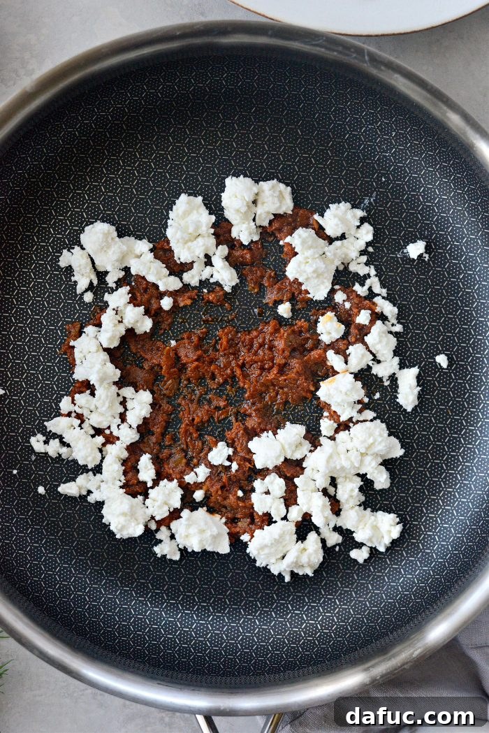 Three Delicious Feta Fried Egg Ideas 4 Pesto and Feta Sizzling in a Nonstick Skillet for Feta Fried Eggs