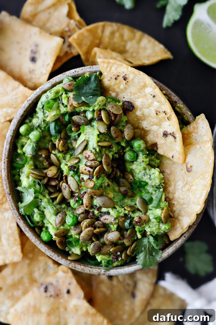 Vibrant Serrano Sweet Pea Guacamole 15 Serrano Sweet Pea Guacamole served with an array of colorful tortilla chips