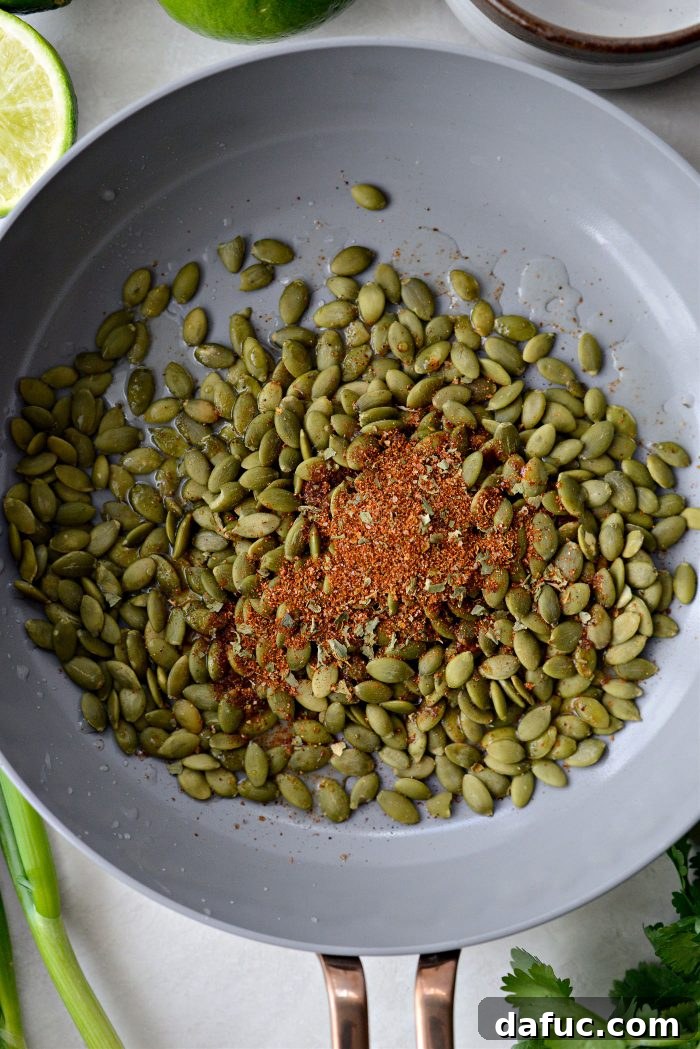 Vibrant Serrano Sweet Pea Guacamole 6 Pepitas, lime juice, and Mexicali seasoning in a nonstick skillet