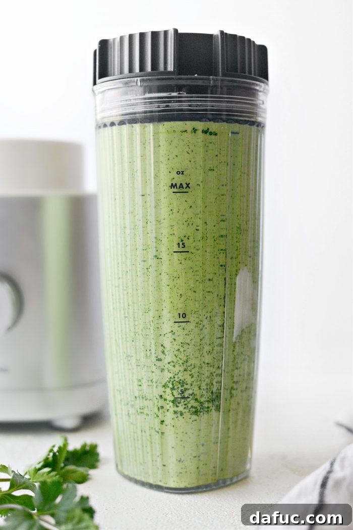 Bright Cilantro Ranch 6 Creamy Cilantro Ranch Dressing being blended in a high-speed blender, showing its smooth texture.