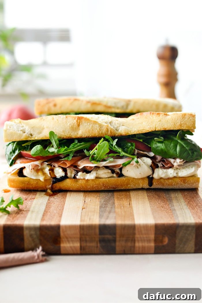 Close-up of a delicious Peach Prosciutto and Burrata Sandwich, highlighting fresh ingredients