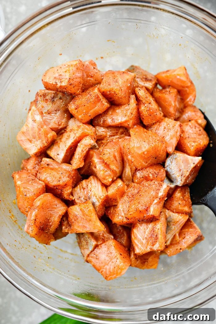 Dynamite Salmon Rice Bowls 9 Tossing seasoned salmon in a bowl