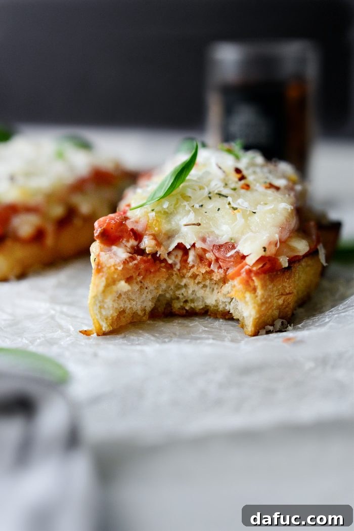 Margherita Toast Pizzas 14 Stack of Margherita Pizza Toasts with a rustic background